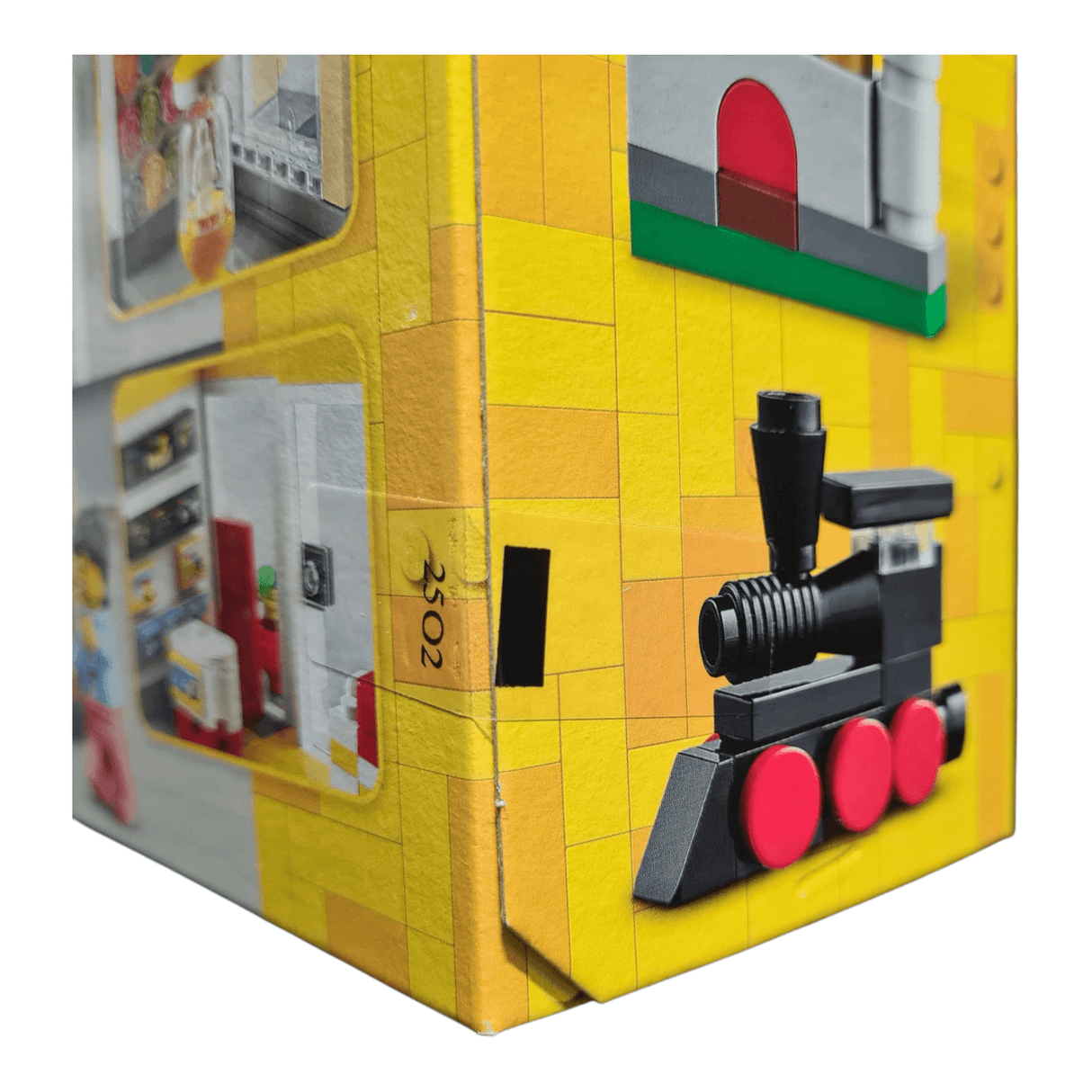 Side view of LEGO 40574 Retail Store set box showing train model and vibrant colors.