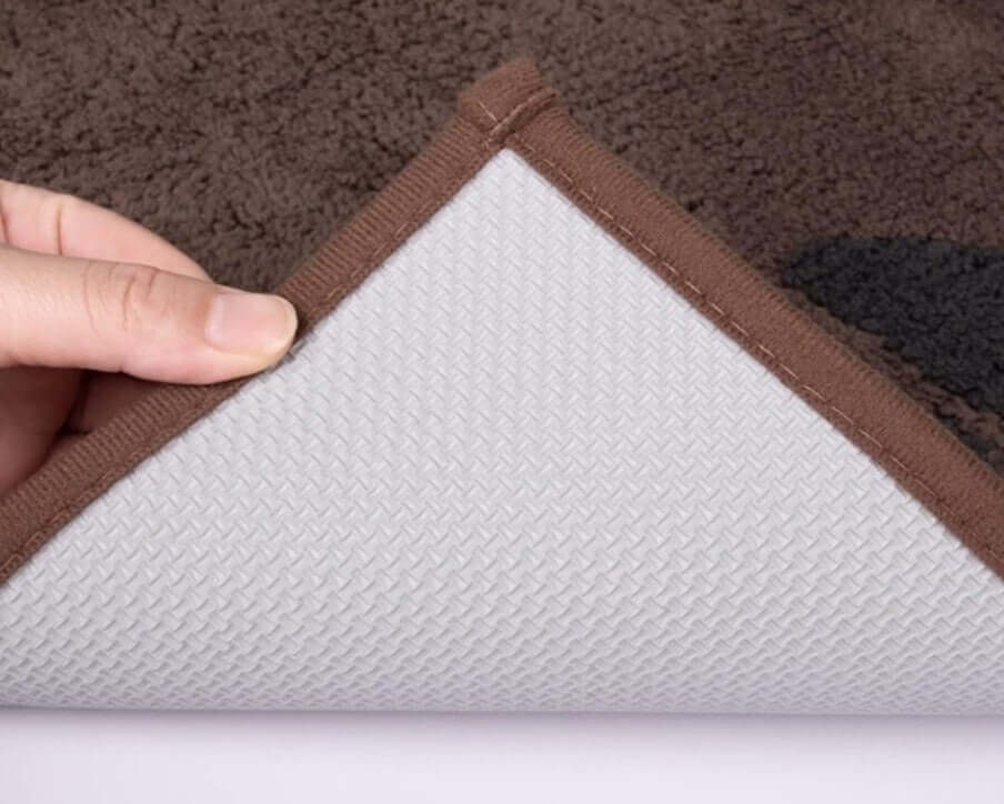 Close-up of PURRUGS doormat showing the rubber backing, highlighting durability and grip for indoor use.
