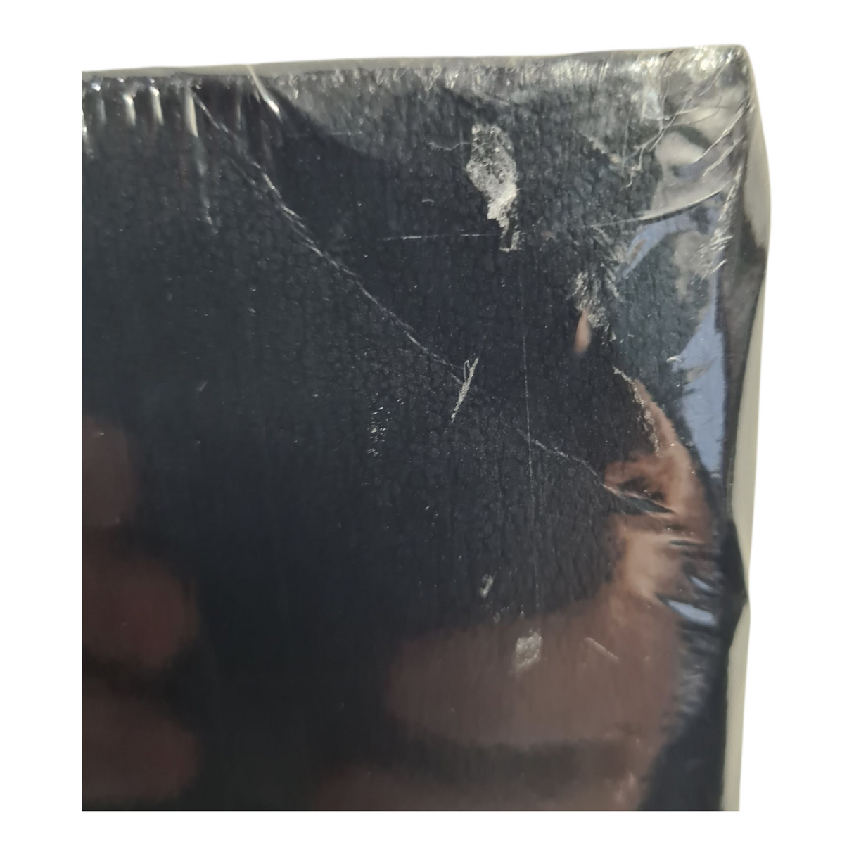 Close-up of slight bump and seal damage on the corner of the 50th Anniversary Atlas from the AA.